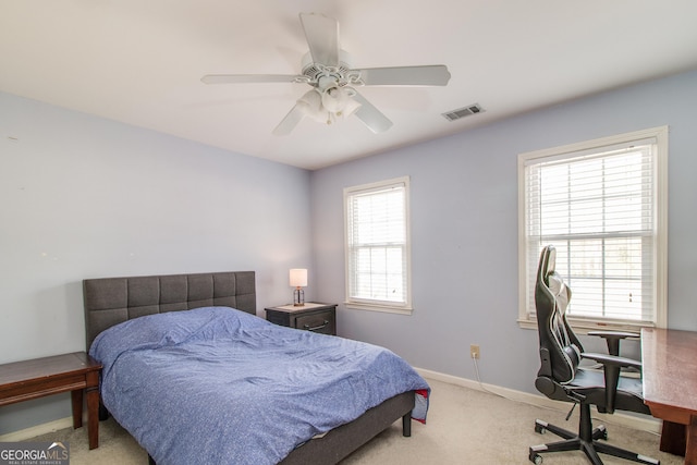 carpeted bedroom with ceiling fan