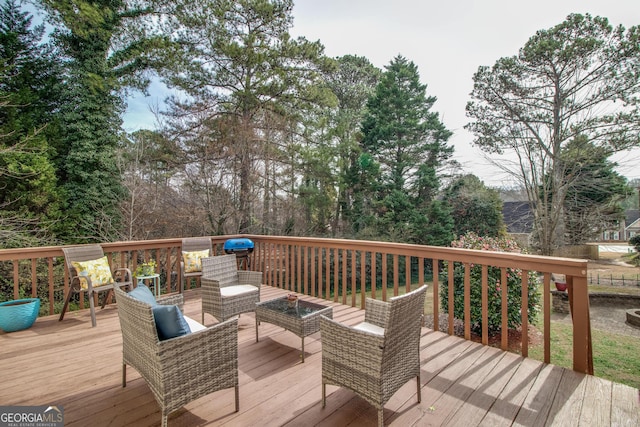 wooden deck with an outdoor hangout area