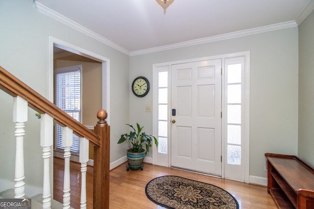 entrance foyer with wood-type flooring and ornamental molding