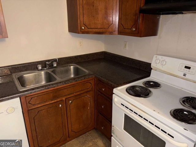 kitchen featuring white appliances, sink, and exhaust hood