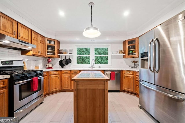 kitchen featuring light countertops, appliances with stainless steel finishes, open shelves, and a kitchen island