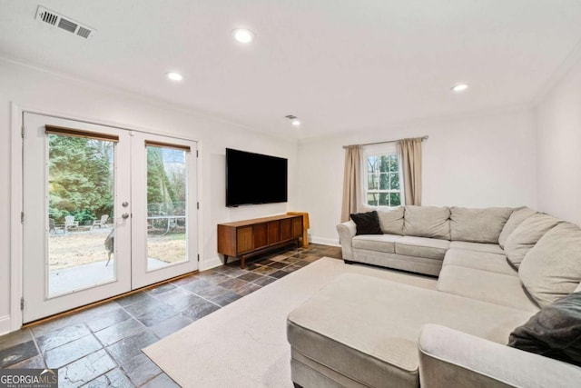 living area featuring recessed lighting, stone tile flooring, visible vents, and french doors