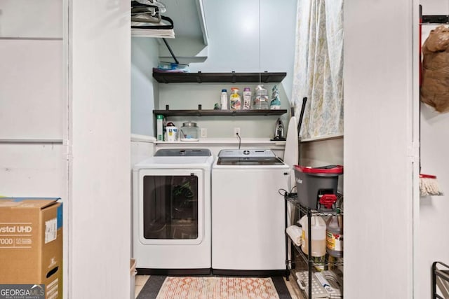 laundry area featuring laundry area and washer and clothes dryer