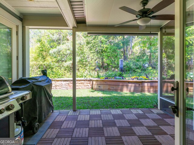 view of patio with grilling area and a ceiling fan