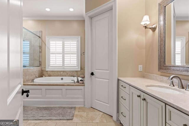 full bathroom with recessed lighting, tile patterned floors, vanity, and a garden tub