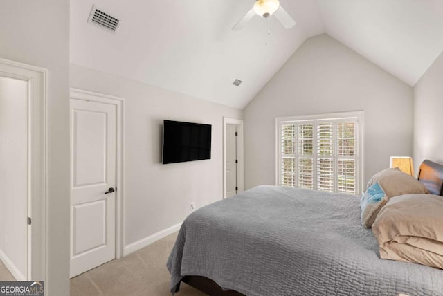 bedroom featuring visible vents, baseboards, light colored carpet, and lofted ceiling
