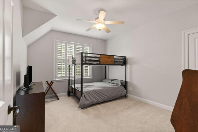 bedroom with ceiling fan, carpet flooring, and baseboards