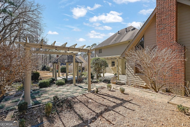 exterior space with a patio area and a pergola