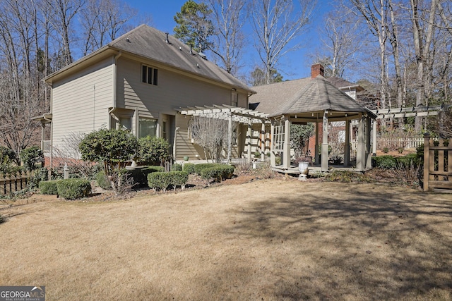 exterior space featuring a patio, a gazebo, fence, and a pergola