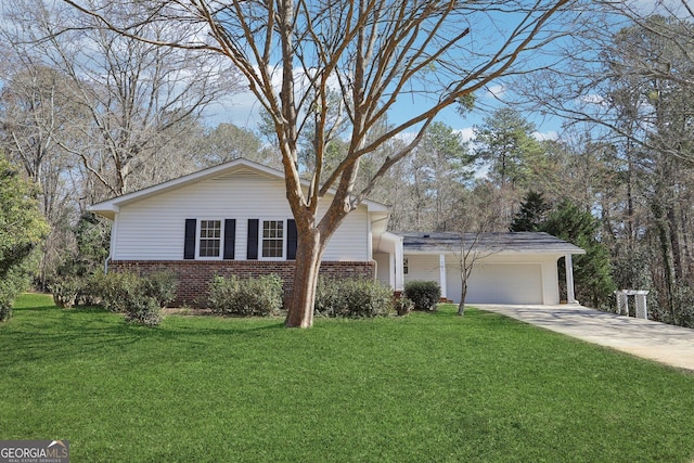 ranch-style house featuring a garage and a front yard