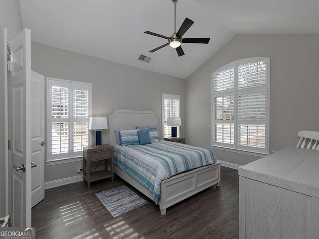 bedroom featuring dark wood-type flooring, ceiling fan, and vaulted ceiling