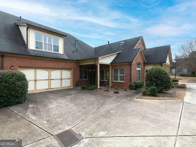 rear view of house featuring a garage