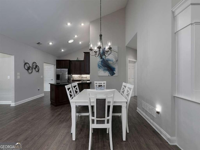 dining space featuring high vaulted ceiling, an inviting chandelier, and dark hardwood / wood-style flooring