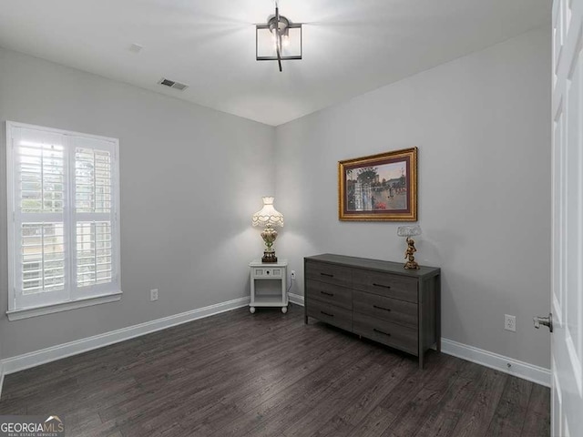 sitting room featuring dark hardwood / wood-style flooring and a healthy amount of sunlight