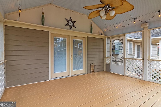 unfurnished sunroom featuring vaulted ceiling and ceiling fan