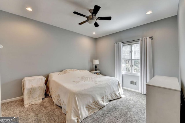 bedroom with baseboards, visible vents, light colored carpet, ceiling fan, and recessed lighting