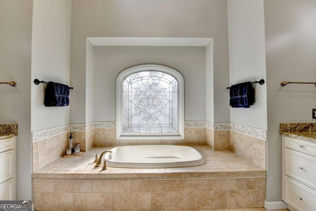 full bathroom featuring vanity and a bath