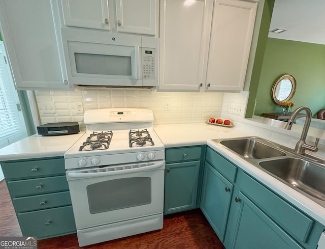 kitchen featuring white appliances, visible vents, green cabinets, and light countertops