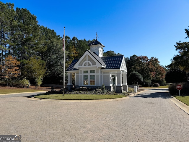 exterior space featuring a standing seam roof and metal roof