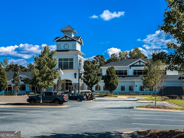 view of property with uncovered parking