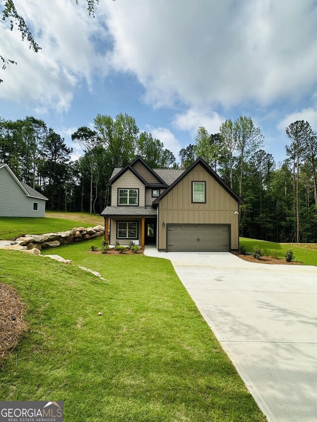 65 Patterson Dr, Franklin, GA 30217 - craftsman-style house featuring board and batten siding, concrete driveway, and a front lawn