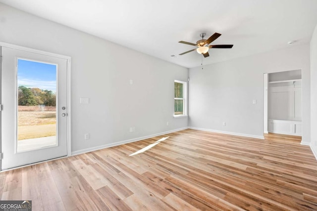 spare room with ceiling fan and light hardwood / wood-style flooring