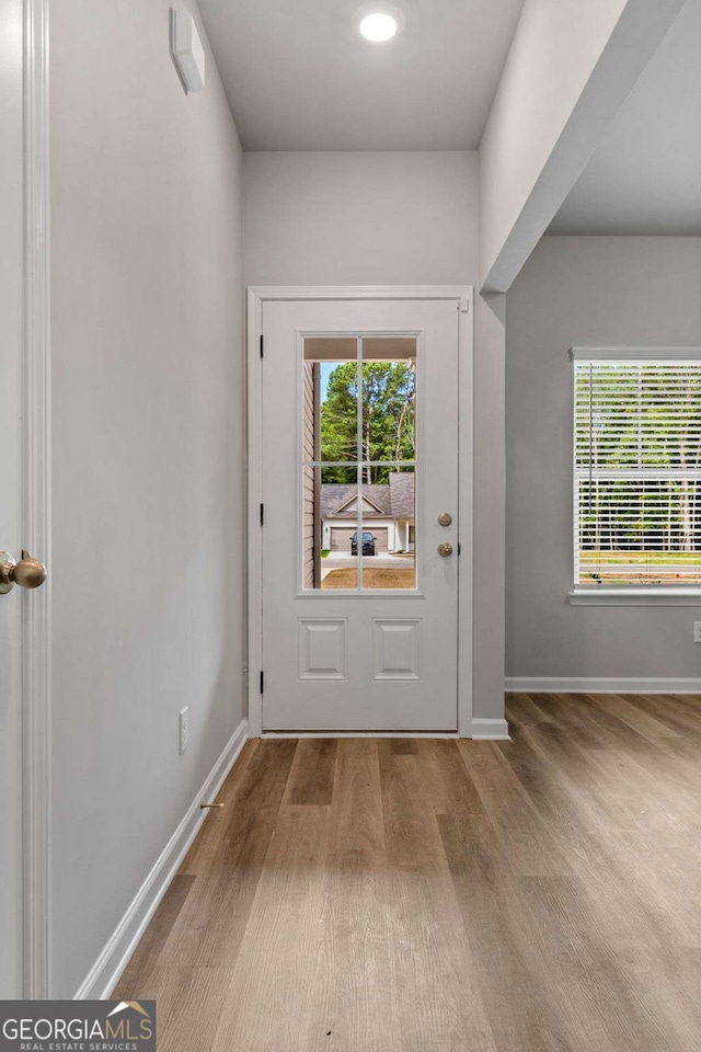 entryway with light hardwood / wood-style floors