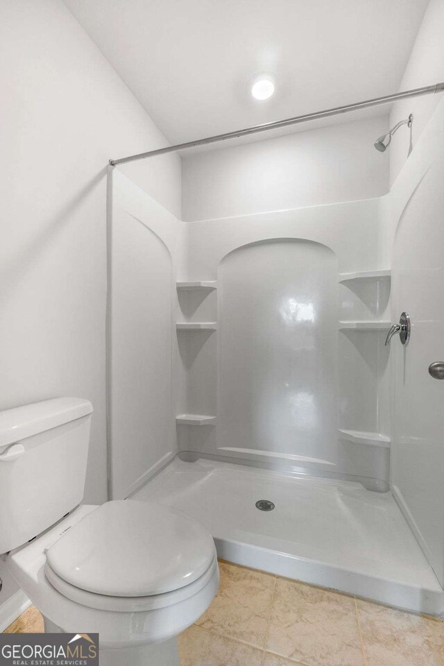 65 Patterson Dr, Franklin, GA 30217 - bathroom with toilet, a walk in shower, and tile patterned floors