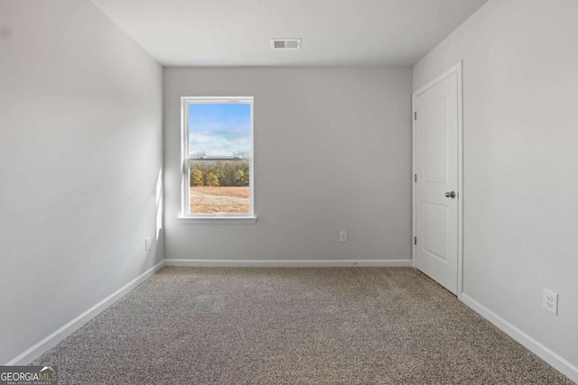 spare room featuring carpet floors