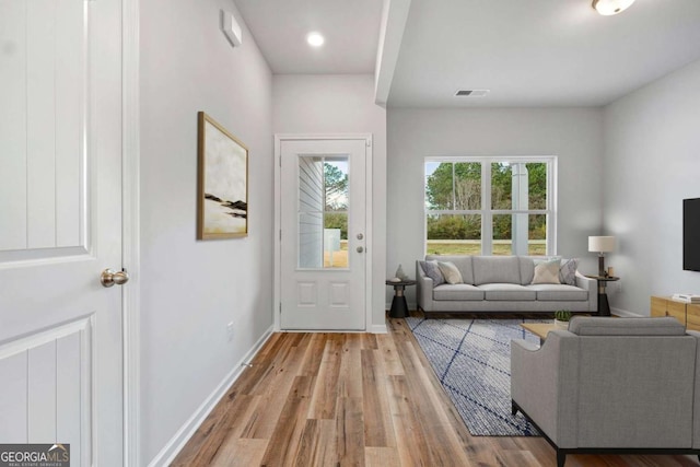 doorway with light hardwood / wood-style floors