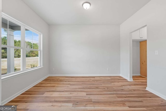 unfurnished room with light hardwood / wood-style floors