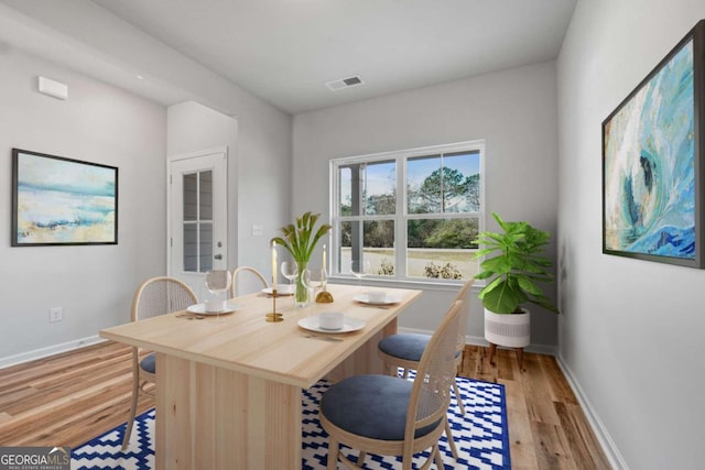 dining room featuring light hardwood / wood-style flooring