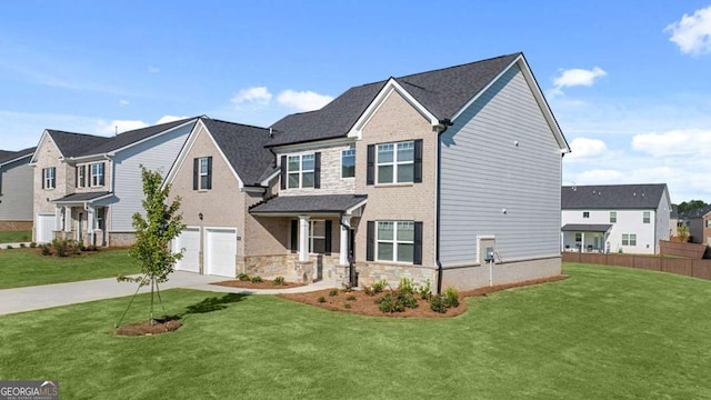 view of front of home with a garage and a front yard