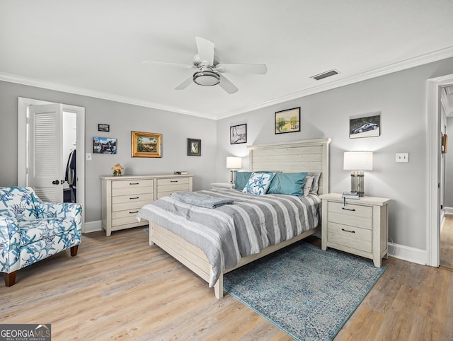 bedroom featuring crown molding, ceiling fan, and light wood-type flooring