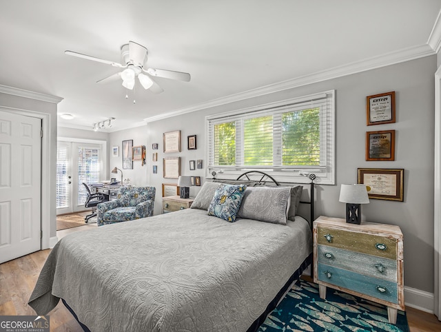 bedroom featuring crown molding, ceiling fan, and wood-type flooring