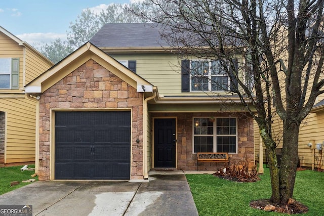 front of property with a garage and a front lawn