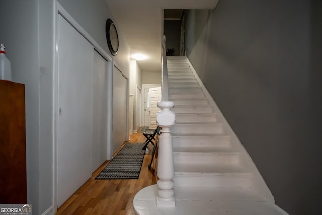 staircase featuring hardwood / wood-style floors