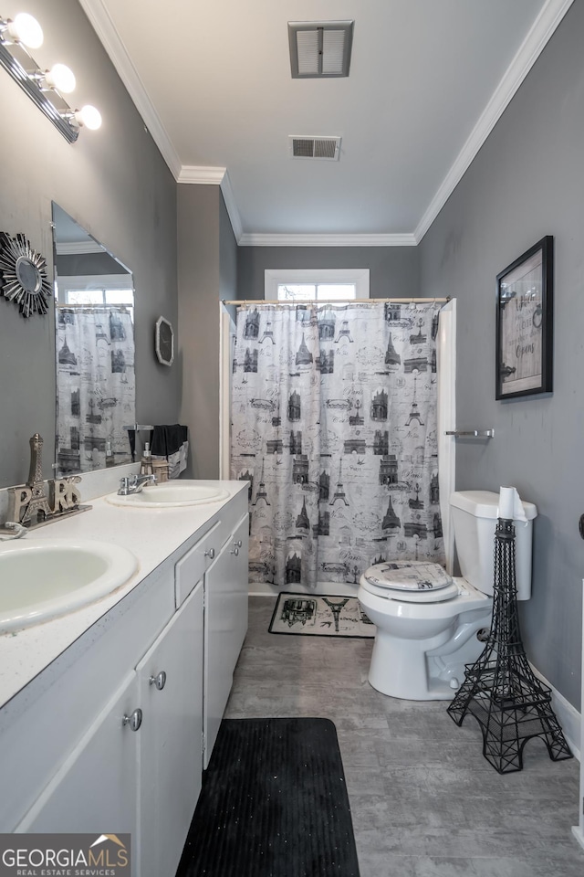 bathroom featuring vanity, crown molding, toilet, and hardwood / wood-style flooring