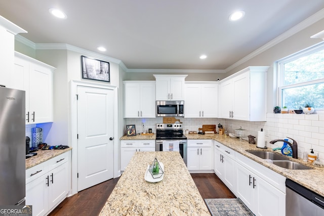 kitchen featuring sink, dark wood-type flooring, appliances with stainless steel finishes, white cabinetry, and light stone countertops