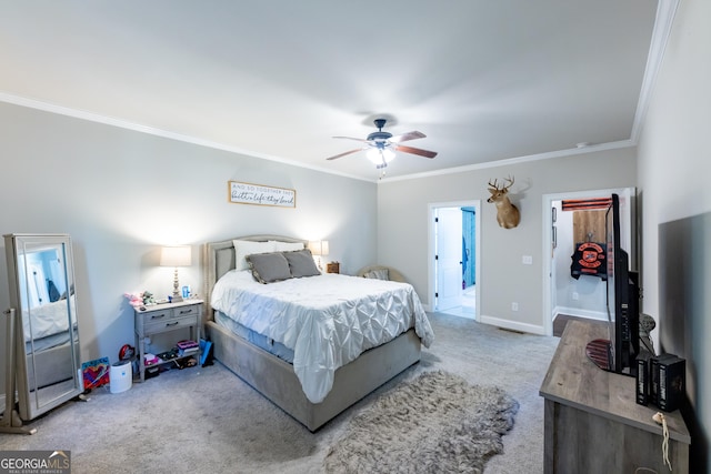 carpeted bedroom featuring ornamental molding and ceiling fan