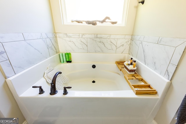 bathroom featuring a washtub