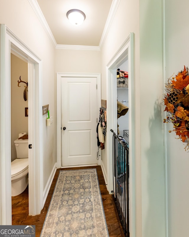 entryway with crown molding and dark hardwood / wood-style floors