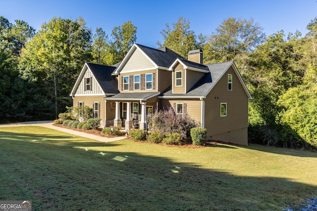 view of front of home featuring a front yard and covered porch