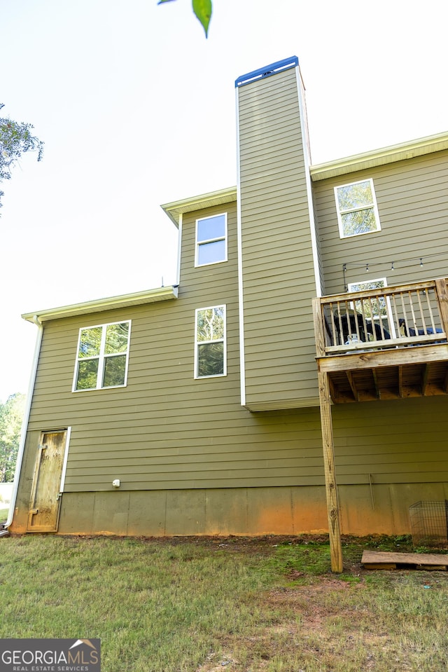 back of house with a yard