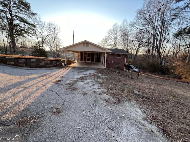 ranch-style house with a carport