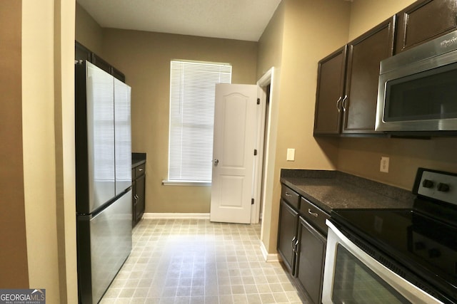 kitchen with dark brown cabinets and stainless steel appliances