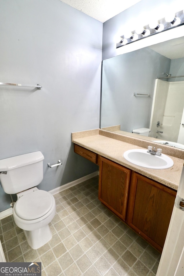 full bathroom with vanity,  shower combination, and toilet