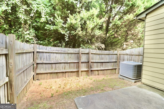 view of yard with central air condition unit