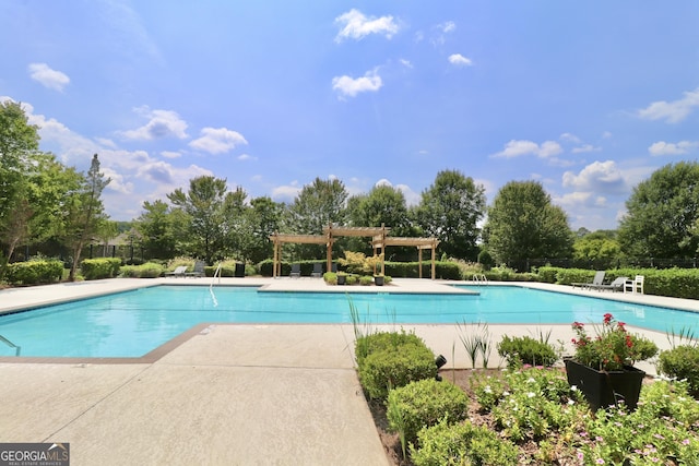 view of pool with a pergola and a patio