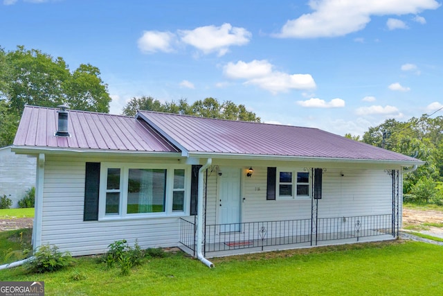 ranch-style home with a front lawn